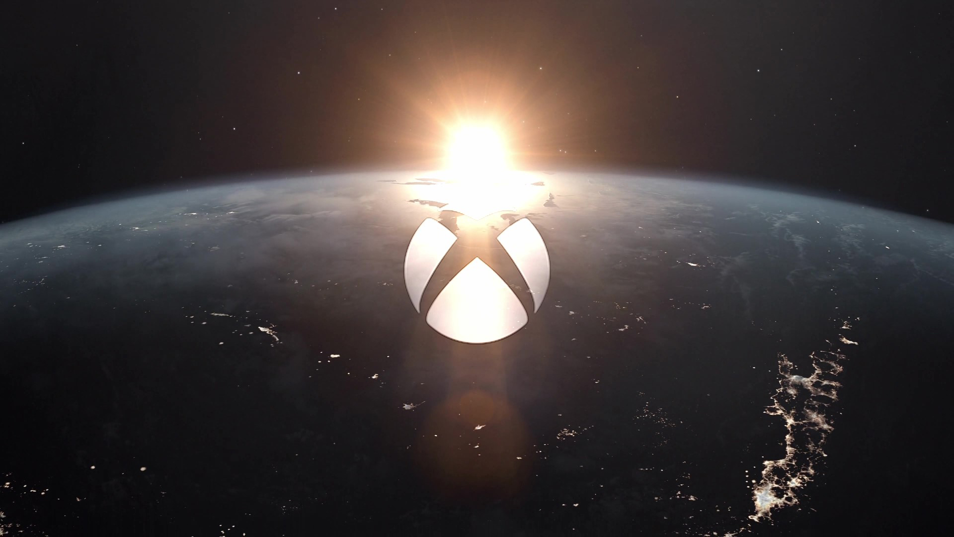 Xbox logo over a picture of the earth with a sunrise